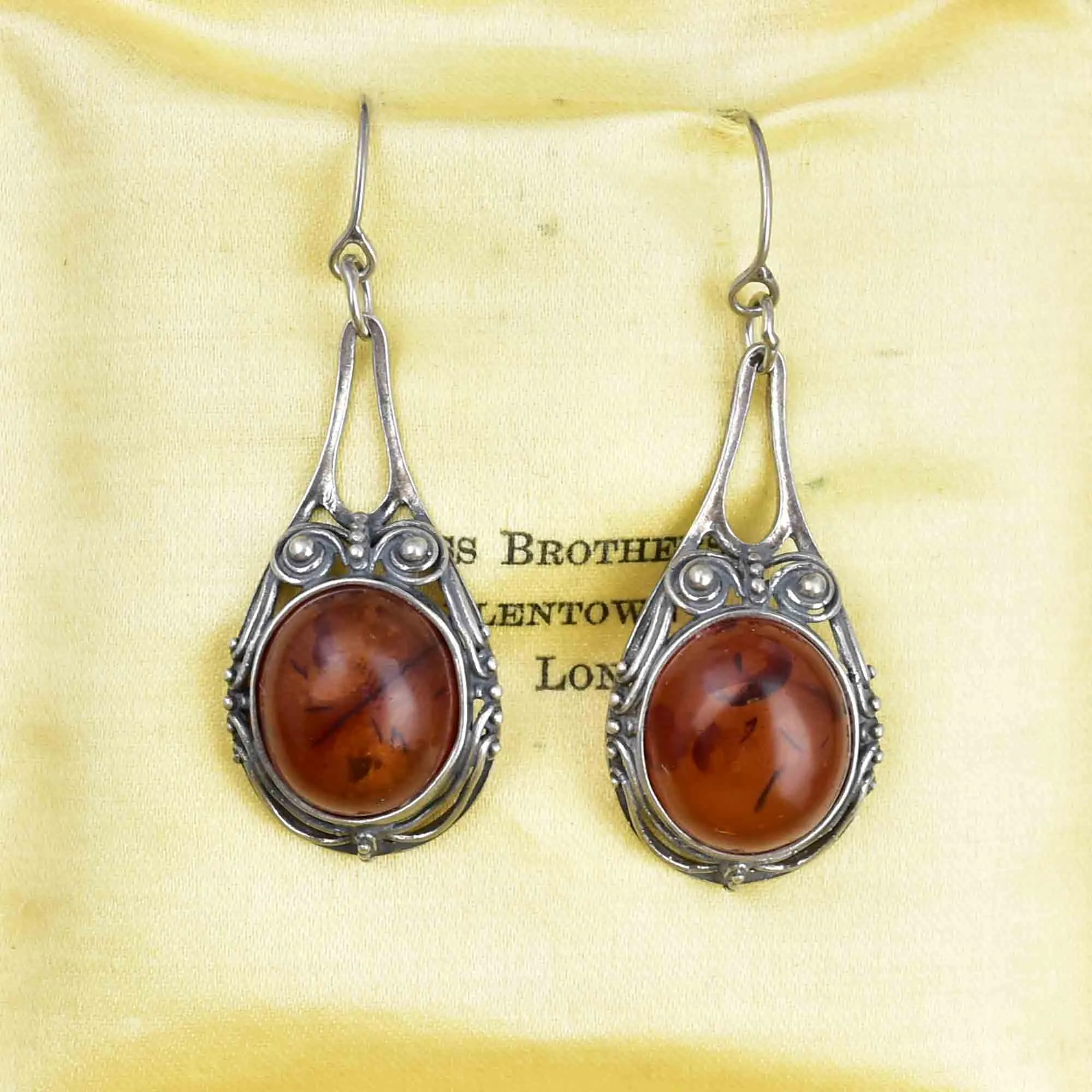 Arts and Crafts Style Silver Scroll Natural Amber Drop Earrings